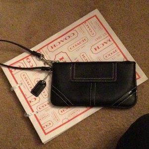 Black leather women’s coach wristlet